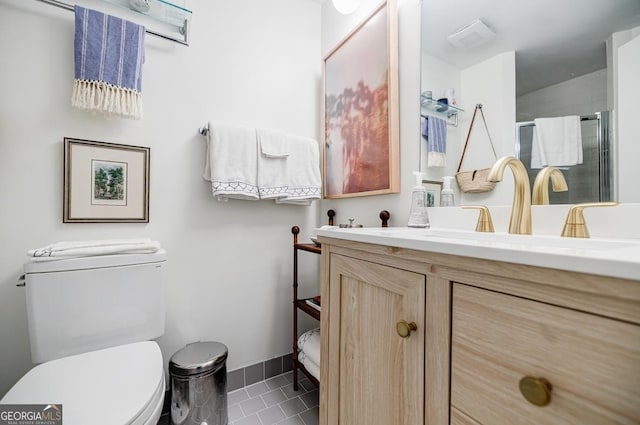 587 Virginia Ave NE Unit 314, Atlanta, GA 30306 - full bath with tile patterned flooring, a stall shower, vanity, baseboards, and toilet