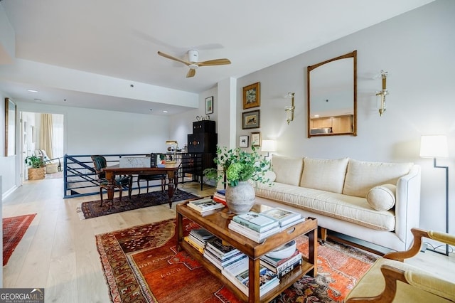 587 Virginia Ave NE Unit 314, Atlanta, GA 30306 - living room featuring a ceiling fan and light wood-style flooring