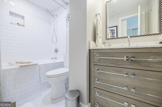587 Virginia Ave NE Unit 314, Atlanta, GA 30306 - bathroom featuring vanity, toilet, tiled shower / bath combo, and tile patterned floors
