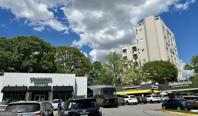 587 Virginia Ave NE Unit 314, Atlanta, GA 30306 - view of building exterior with uncovered parking