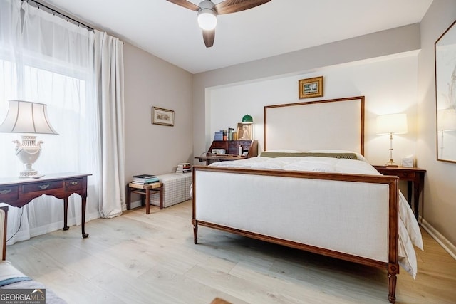 587 Virginia Ave NE Unit 314, Atlanta, GA 30306 - bedroom featuring baseboards, a ceiling fan, and light wood-type flooring