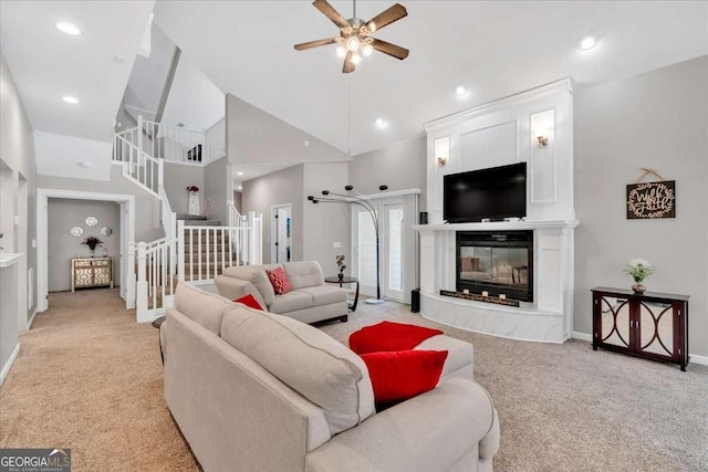 3800 Macland Rd, Hiram, GA 30141 - living area with light carpet, a ceiling fan, stairs, high vaulted ceiling, and a premium fireplace