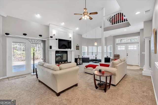 3800 Macland Rd, Hiram, GA 30141 - living room featuring a ceiling fan, light carpet, a towering ceiling, a glass covered fireplace, and recessed lighting