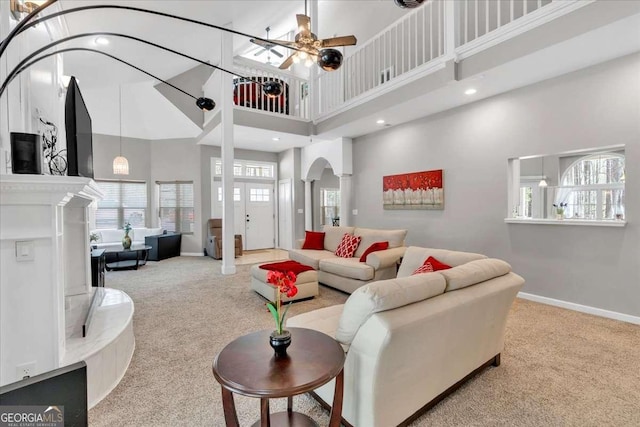3800 Macland Rd, Hiram, GA 30141 - carpeted living area with a high ceiling, decorative columns, arched walkways, a ceiling fan, and recessed lighting