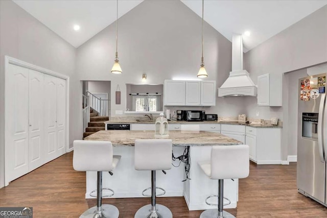 3800 Macland Rd, Hiram, GA 30141 - kitchen featuring custom exhaust hood, high vaulted ceiling, stainless steel fridge with ice dispenser, white cabinetry, and a kitchen bar
