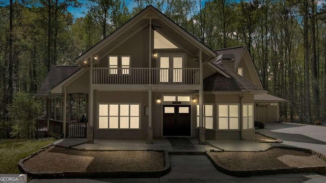 3800 Macland Rd, Hiram, GA 30141 - chalet / cabin featuring a balcony, stucco siding, concrete driveway, and a shingled roof