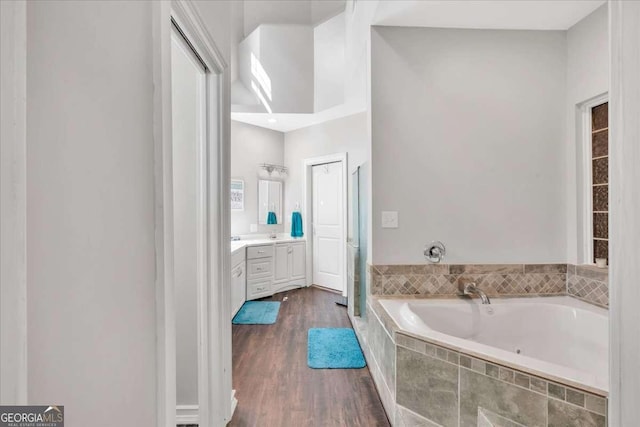 3800 Macland Rd, Hiram, GA 30141 - full bath with vanity, a jetted tub, and wood finished floors