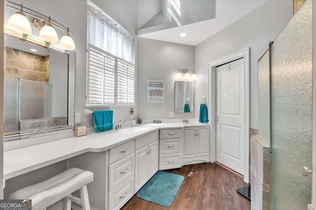 3800 Macland Rd, Hiram, GA 30141 - bathroom featuring a shower stall, double vanity, wood finished floors, recessed lighting, and a towering ceiling