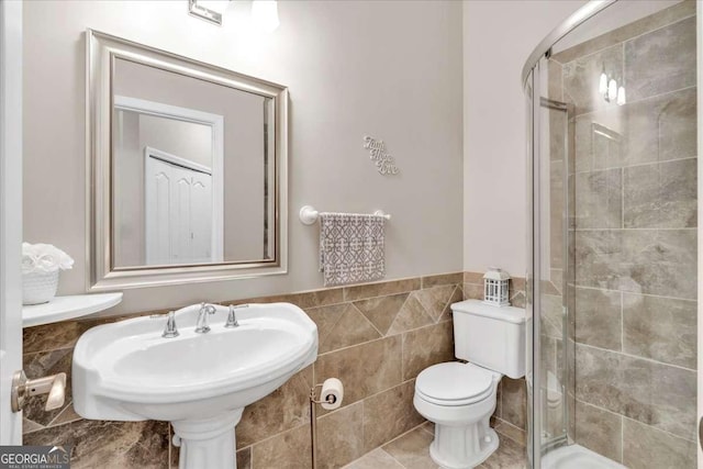 3800 Macland Rd, Hiram, GA 30141 - full bathroom featuring a shower stall, tile walls, and wainscoting