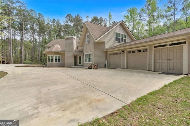 3800 Macland Rd, Hiram, GA 30141 - view of front of home with driveway, a garage, and roof with shingles