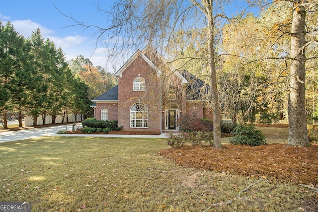 1418 Brighton Pl, Loganville, GA 30052 - view of front facade featuring brick siding and a front lawn