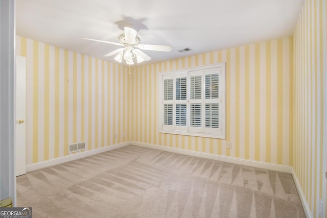 1418 Brighton Pl, Loganville, GA 30052 - carpeted empty room with ceiling fan