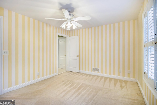 1418 Brighton Pl, Loganville, GA 30052 - carpeted spare room featuring ceiling fan and baseboards