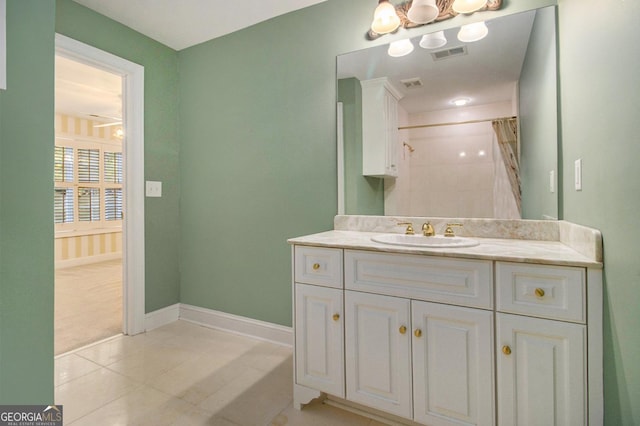 1418 Brighton Pl, Loganville, GA 30052 - bathroom featuring vanity, tile patterned floors, baseboards, and curtained shower