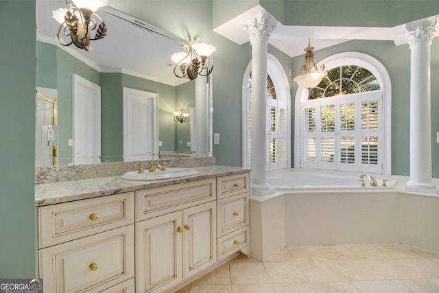 1418 Brighton Pl, Loganville, GA 30052 - full bath with decorative columns, a garden tub, vanity, a chandelier, and crown molding