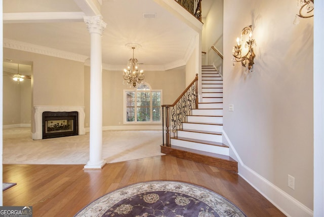 1418 Brighton Pl, Loganville, GA 30052 - foyer entrance featuring wood finished floors, stairway, baseboards, and ornamental molding