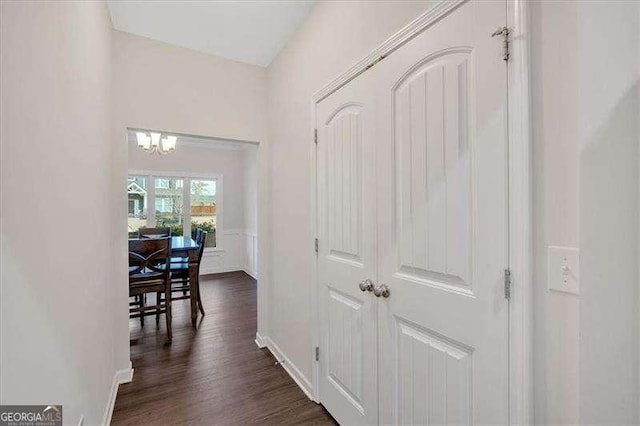 822 Pine Way, Dallas, GA 30157 - hallway with a chandelier and dark wood-type flooring