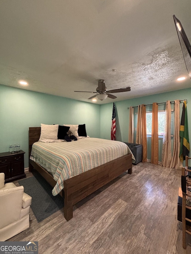 2220 Wellington Cir, Lithonia, GA 30058 - bedroom featuring recessed lighting, a ceiling fan, and wood finished floors