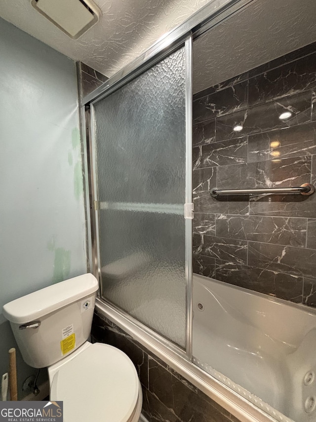 2220 Wellington Cir, Lithonia, GA 30058 - full bath featuring toilet and enclosed tub / shower combo