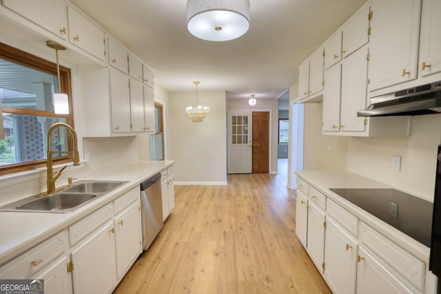 kitchen with under cabinet range hood, dishwasher, a sink, and white cabinets