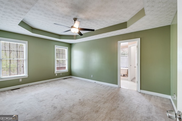 86 S Chattahoochee Dr, Hogansville, GA 30230 - unfurnished room with a textured ceiling, a raised ceiling, carpet, and ceiling fan