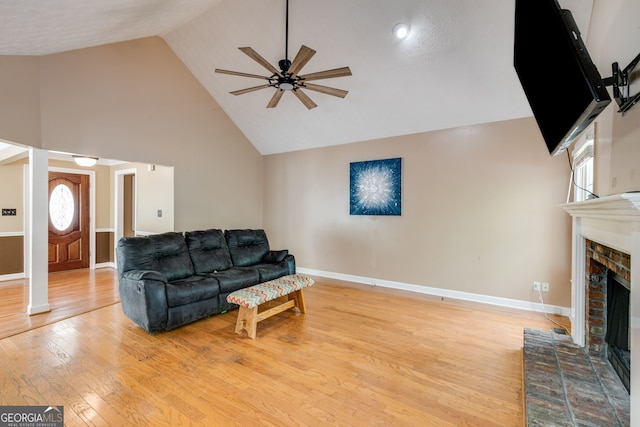 86 S Chattahoochee Dr, Hogansville, GA 30230 - living area featuring high vaulted ceiling, ceiling fan, a fireplace, and light wood-style floors