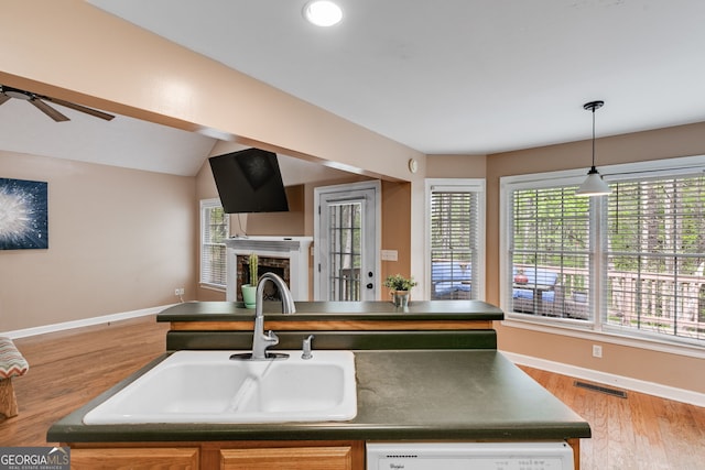 86 S Chattahoochee Dr, Hogansville, GA 30230 - kitchen with dark countertops, a fireplace, open floor plan, wood finished floors, and a ceiling fan