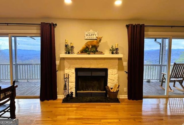 7 Lakeview Dr, Hayesville, NC 28904 - living room featuring baseboards, a stone fireplace, recessed lighting, and wood finished floors