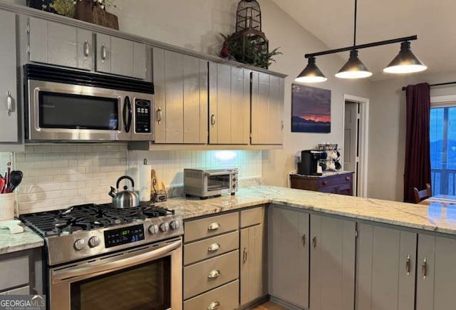 7 Lakeview Dr, Hayesville, NC 28904 - kitchen featuring lofted ceiling, a toaster, decorative backsplash, appliances with stainless steel finishes, and gray cabinets