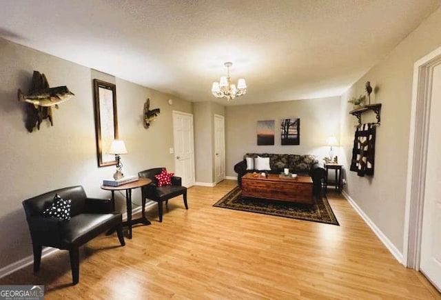 7 Lakeview Dr, Hayesville, NC 28904 - living room featuring baseboards, a chandelier, and light wood-style flooring