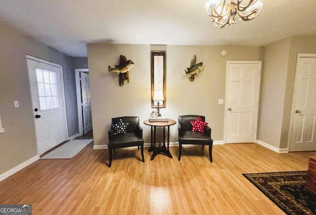 7 Lakeview Dr, Hayesville, NC 28904 - living area with a chandelier, baseboards, and light wood finished floors