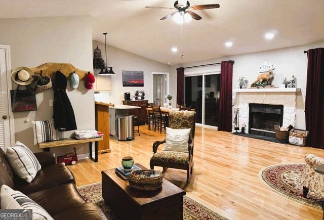 7 Lakeview Dr, Hayesville, NC 28904 - living room with lofted ceiling, recessed lighting, a fireplace, a ceiling fan, and light wood-style floors