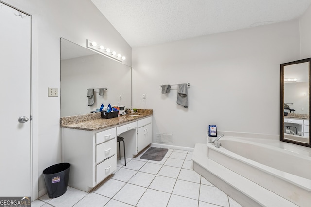 bathroom featuring tile patterned flooring, vaulted ceiling, visible vents, vanity, and a garden tub