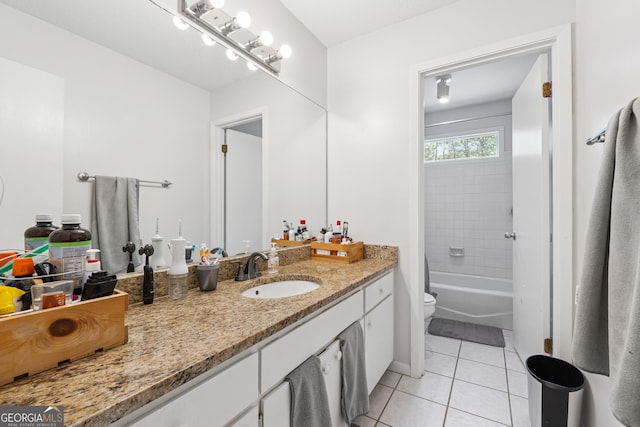 full bath with bathing tub / shower combination, vanity, tile patterned flooring, and toilet