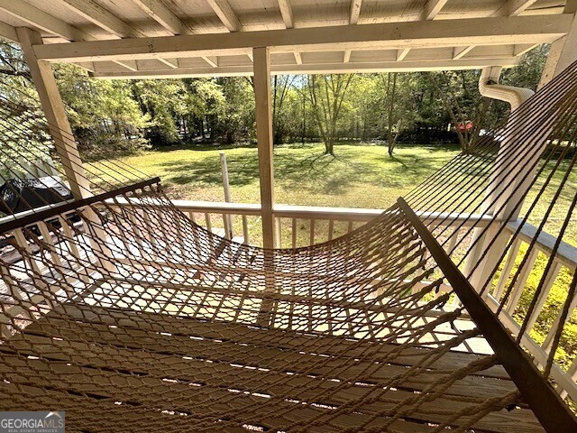deck featuring a lawn