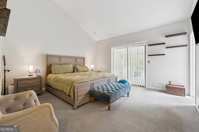 bedroom with access to outside, high vaulted ceiling, and light colored carpet