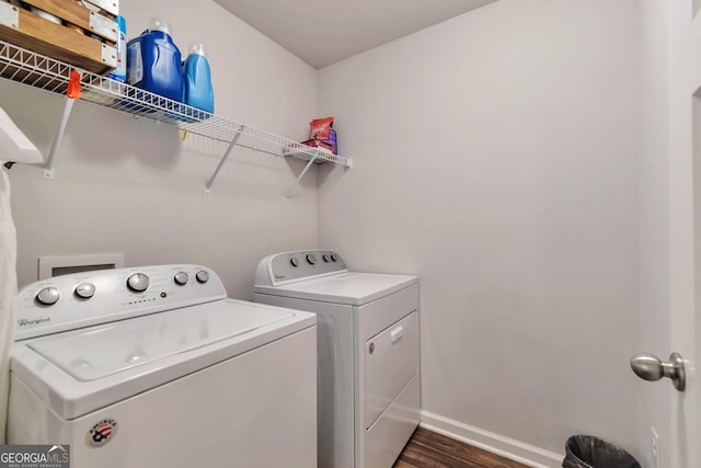 laundry room featuring washer and clothes dryer, dark wood-style floors, laundry area, and baseboards