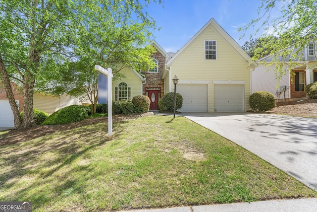 traditional home with an attached garage, stone siding, a front lawn, and driveway