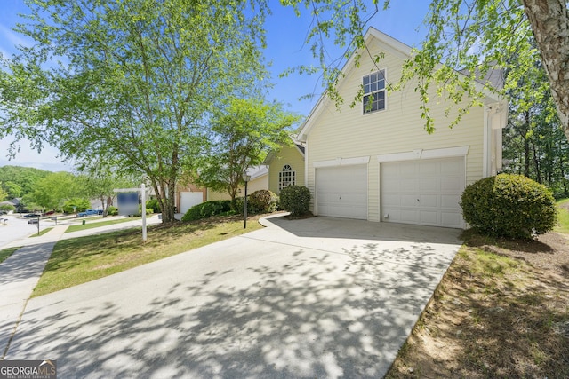 traditional home featuring driveway and a garage