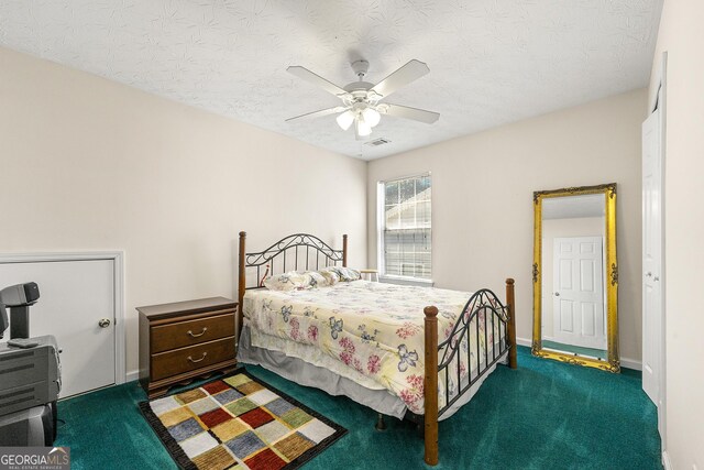545 Goldfinch Way, Stockbridge, GA 30281 - carpeted bedroom with a textured ceiling and a ceiling fan