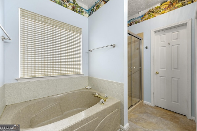 full bathroom featuring a bath and a shower stall