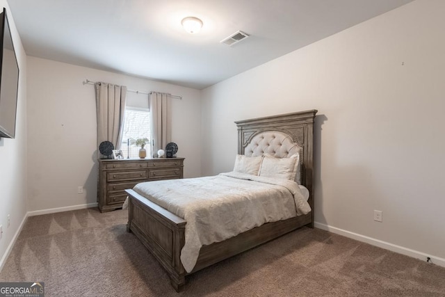 bedroom with visible vents, baseboards, and light colored carpet