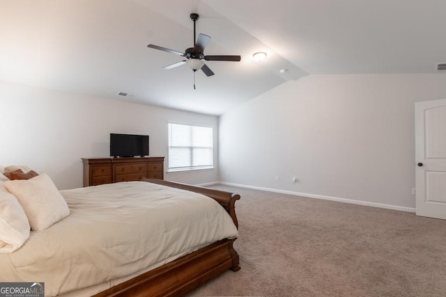 carpeted bedroom featuring visible vents, baseboards, a ceiling fan, and vaulted ceiling