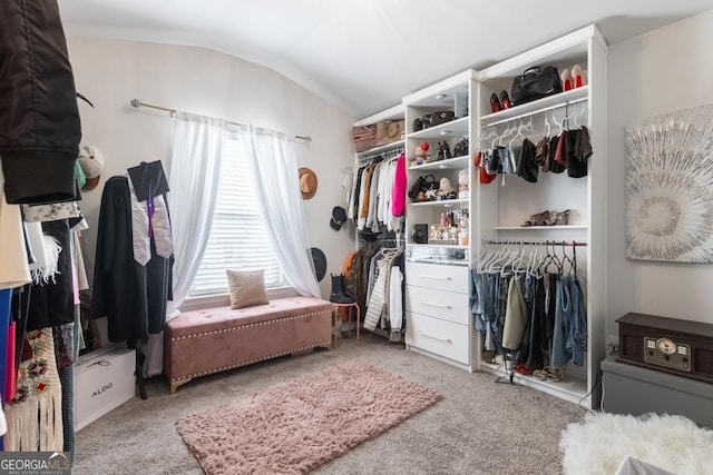 spacious closet with carpet and lofted ceiling