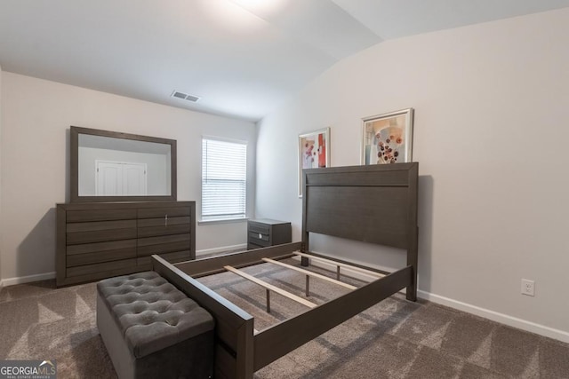 bedroom with visible vents, baseboards, carpet flooring, and vaulted ceiling