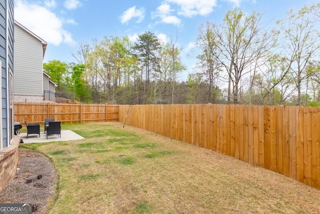 view of yard featuring a fenced backyard and a patio