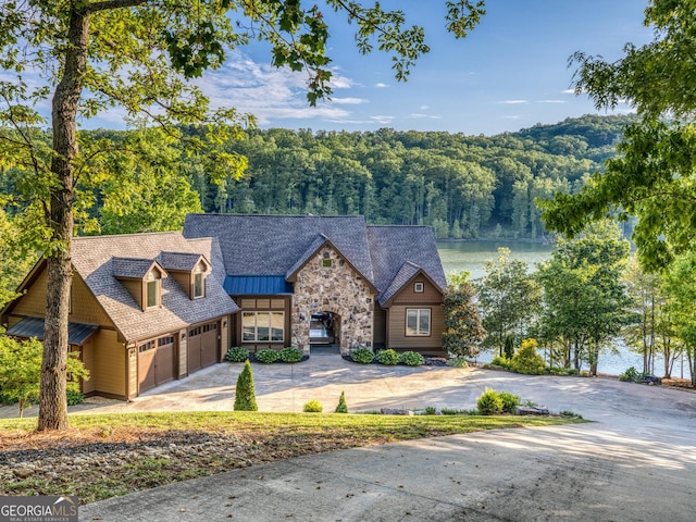 97 E Laceola Rd S, Cleveland, GA 30528 - view of front of property featuring a forest view, driveway, a standing seam roof, a water view, and stone siding