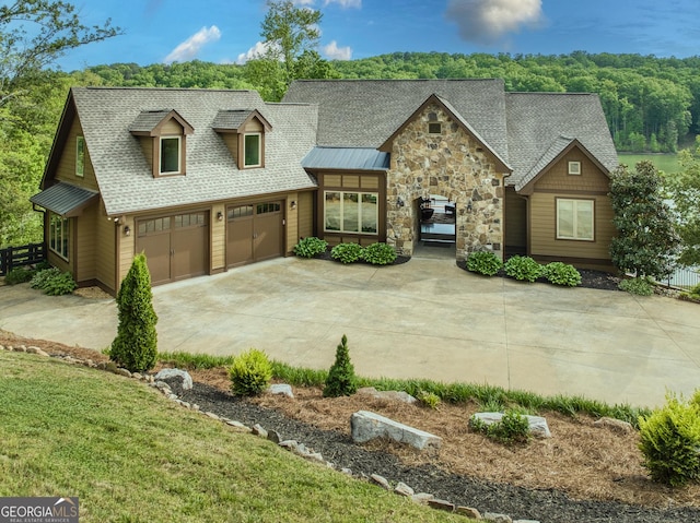 97 E Laceola Rd S, Cleveland, GA 30528 - view of front of house featuring driveway, fence, a garage, stone siding, and roof with shingles