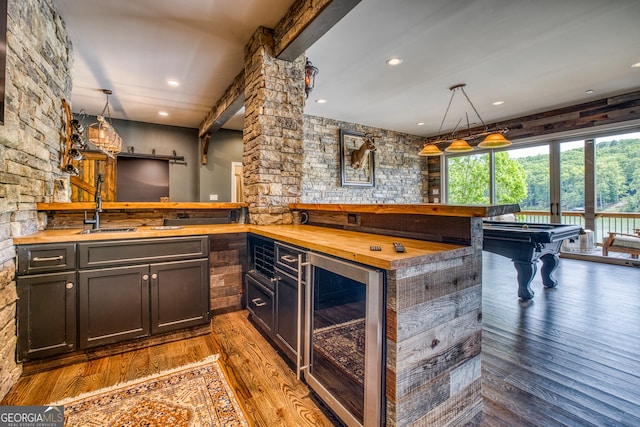 97 E Laceola Rd S, Cleveland, GA 30528 - bar featuring a sink, indoor bar, wood finished floors, pool table, and beverage cooler