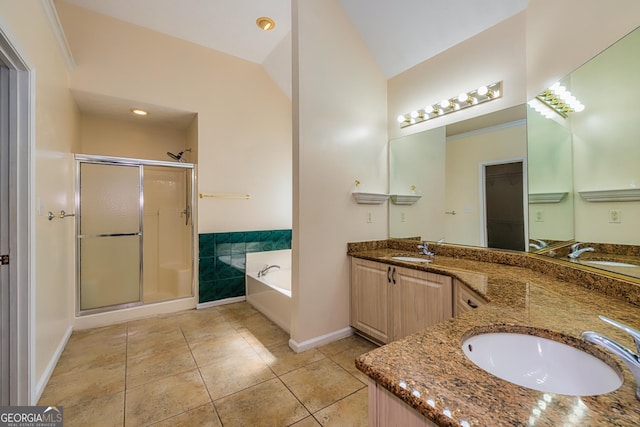 230 Hidden Brook Trl, Fayetteville, GA 30215 - bathroom featuring a stall shower, a garden tub, double vanity, baseboards, and vaulted ceiling